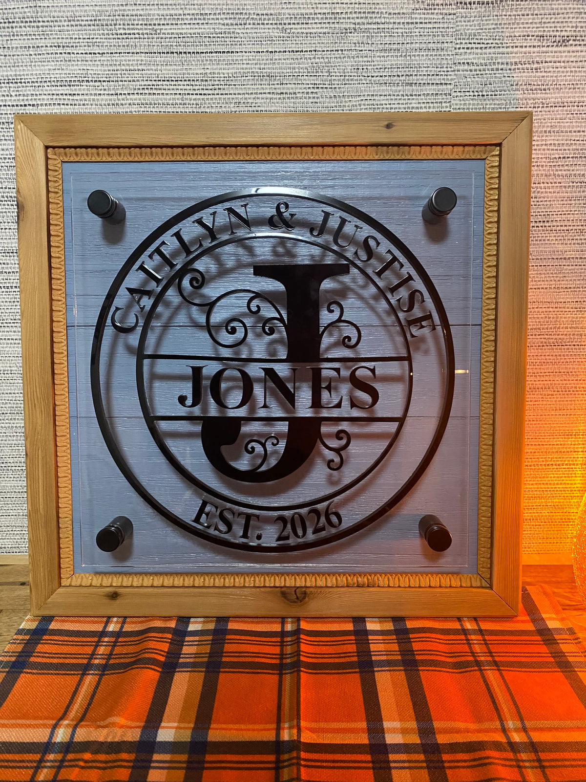 Personalized cedar framed sign with blue shiplap, clear acrylic panel and raised black acrylic family monogram
