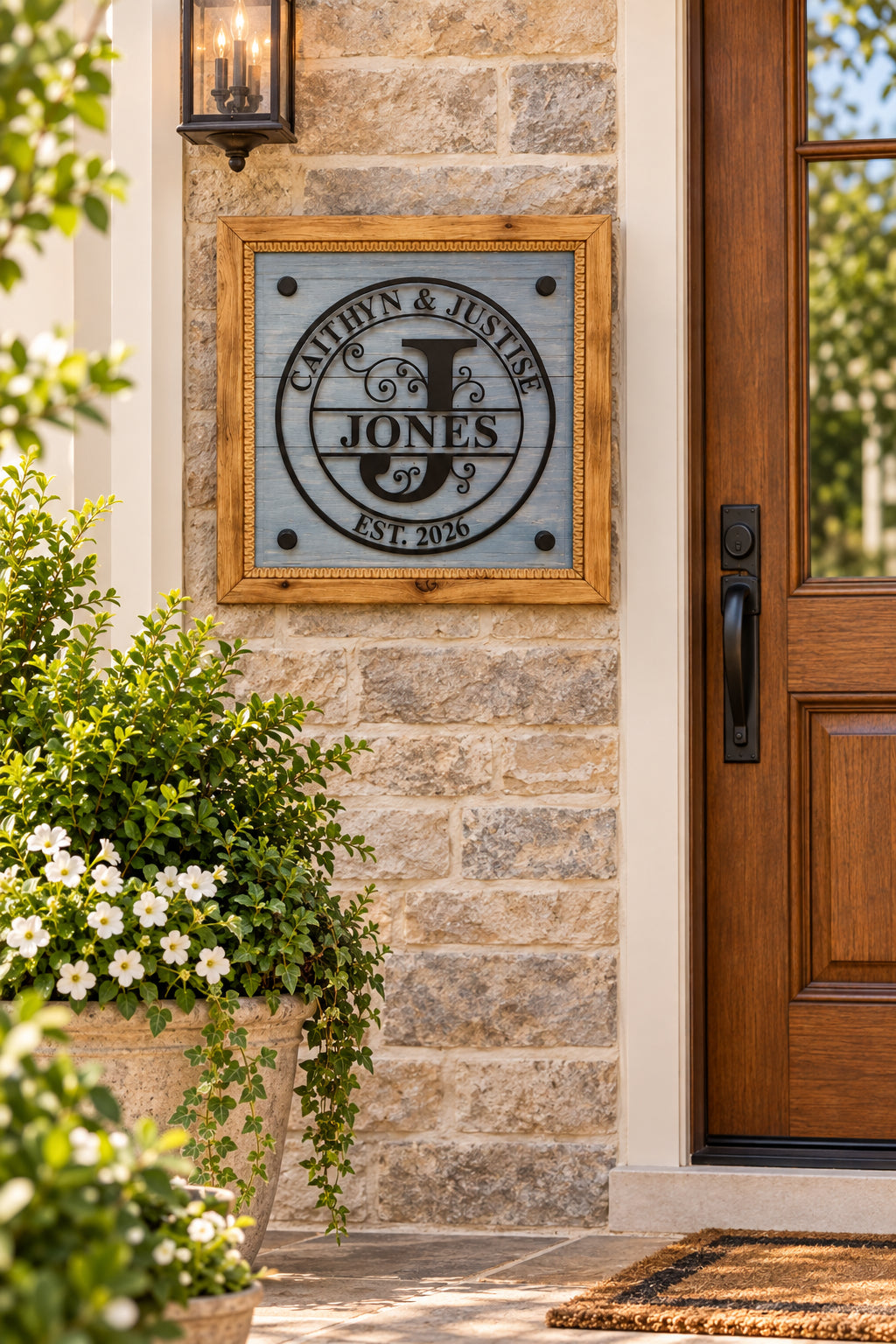 Cedar framed family monogram sign displayed with blue shiplap, black acrylic names and established year